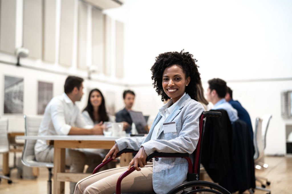 Portrait of a business woman with disability during a business meeting
