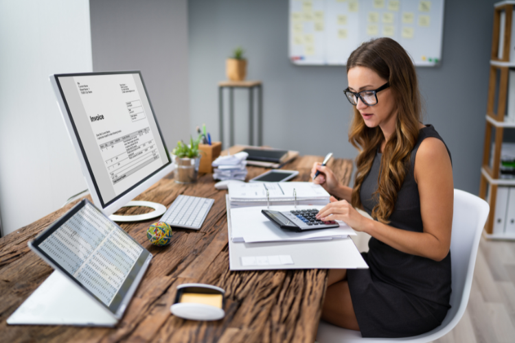 Business women calculating business finances.