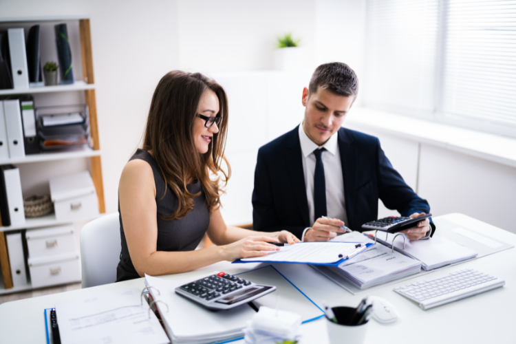 Two Business People Doing Finance Work