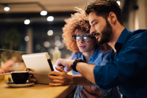 Two young entrepreneurs looking at a laptop