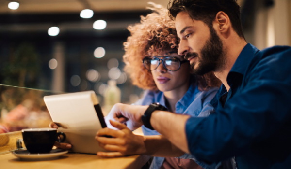 Two young entrepreneurs looking at a laptop