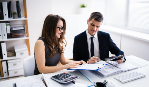 Two Business People Doing Finance Work